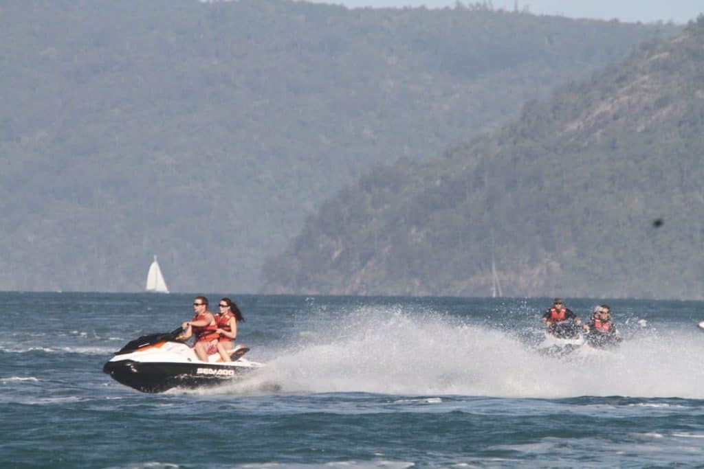 Example of riding a Sea-Doo with a passenger at high speed and others following
