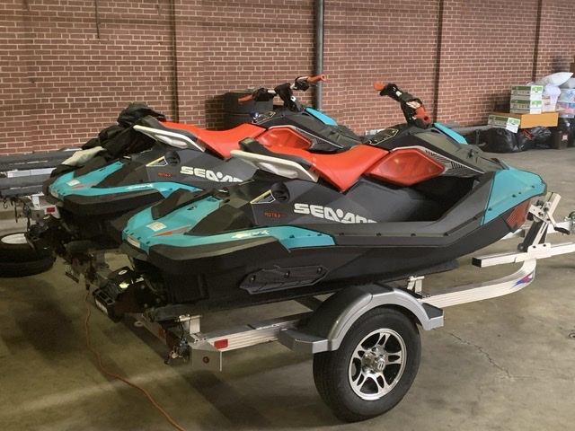 Sea Doo Sparks in blue and red colors on double trailer