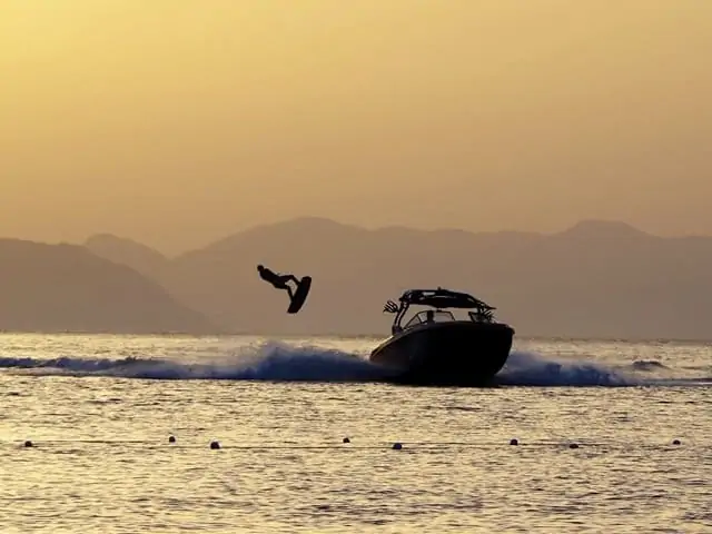 Wakeboarding at sunset. Wakeboards are towed around 25 mph but the boats can often reach 50 mph