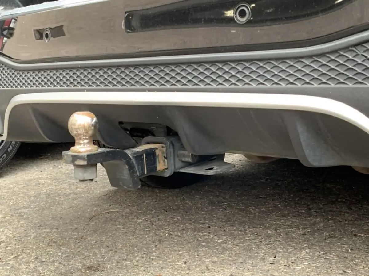 Aftermarket hitches can be installed on most vehicles but usually end up lower than factory mount