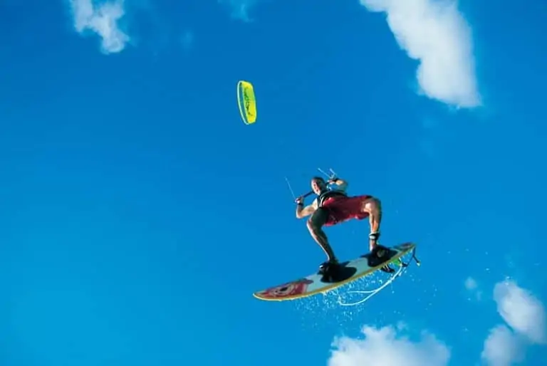 A kitesurfer high in the air