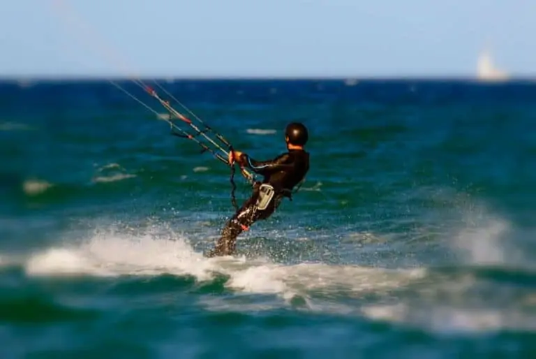 Guy kitesurfing